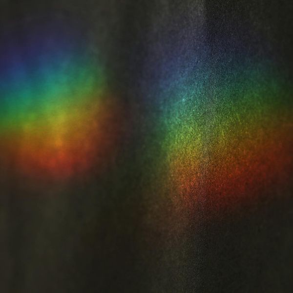 Abstract light prism on a dark grey background