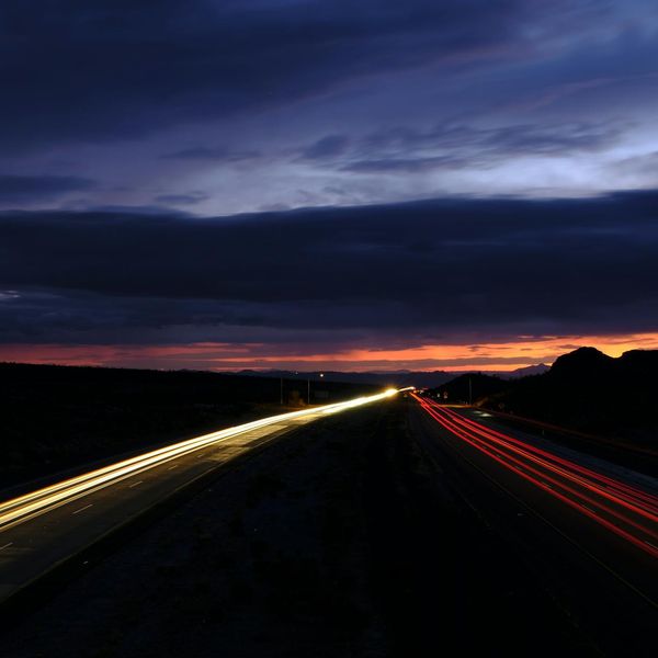 Blurred motion of clouds moving across the night sky